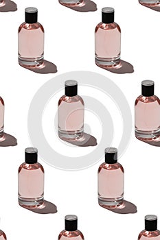 Group of bottles with pink perfumes on white background fashion and beauty