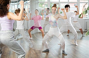 Group of boys and girls dancing dancehall