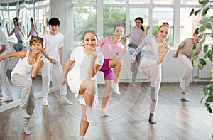 Group of boys and girls dancing dancehall