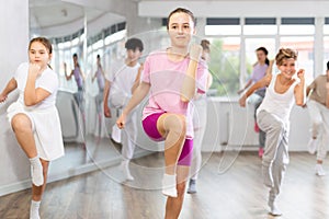 Group of boys and girls dancing dancehall