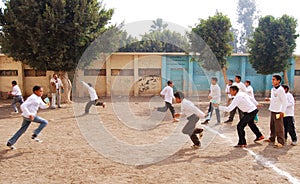 Group of Boys playing soccer in egypt