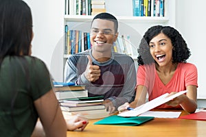 Group of brazilian male and female students learning together