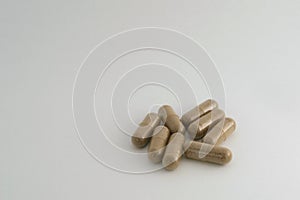 Group of brown herbal capsule - alternative medicine treatment pill