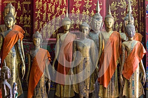 A group of buddha statues (standing) photo