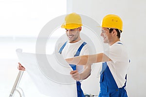 Group of builders with blueprint