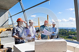 Group Of Builders On Construction Site Building Team Of Apprentices Meeting With Contractor Review Project Plan