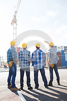 Group of builders in hardhats outdoors