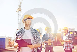 Group of builders in hardhats outdoors