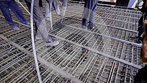 A group of builders poured concrete. The foundation of a large construction site, the builders are building a skyscraper