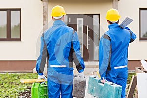 Group of builders with toolboxes