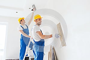 Group of builders with tools indoors