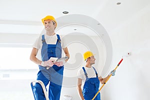 Group of builders with tools indoors