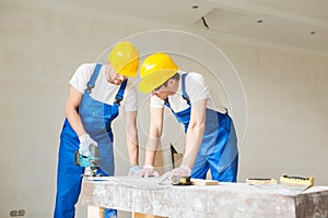 Group of builders with tools indoors