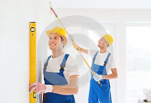 Group of builders with tools indoors