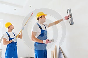 Group of builders with tools indoors