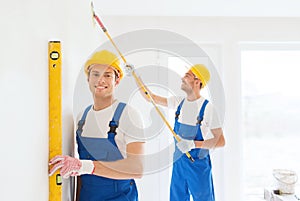 Group of builders with tools indoors