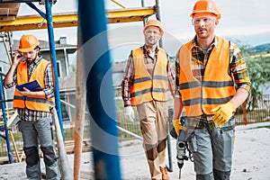 group of builders working together