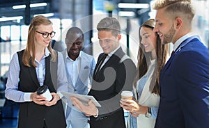 Group of buisness people working on tablet