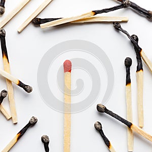 Group of burnt matches with one unused matchstick
