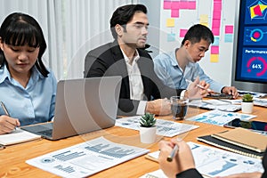 Group of business analyst team analyzing financial data report. Habiliment