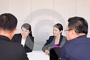 Group of business asian people meeting and working communicating while sitting at room office desk together,Teamwork Concept
