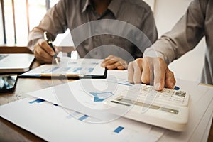 Group of Business executives analysis data document and calculating about fee tax at a office