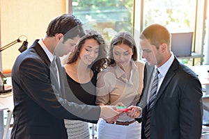 Group of business people assembling jigsaw puzzle and represent