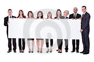 Group of business people with a blank banner