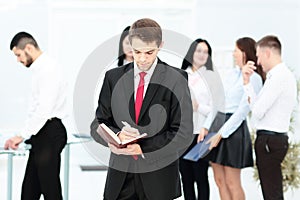 Group of business people with businessman leader on foreground photo