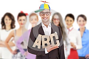 Group of business people with businessman leader in funny hat