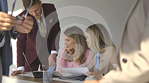 Group of business people discussing new project in modern office