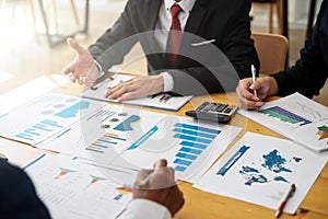 Group of business people discussing project plan together with analyzing data financial report in meeting room. Finance accounting