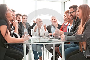 Group of business people or employees meeting or seminar in offi