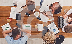 Group of business people exhausted sleep in office, top view