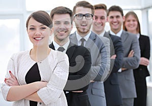 Group of business people with female leader in front