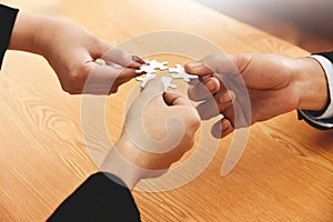 Group of Business people hands are connecting jigsaw puzzle.