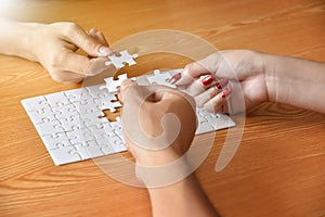 Group of Business people hands are connecting jigsaw puzzle.