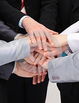 Group of business people with hands together