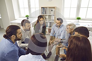 Group of business people having a discussion during a work meeting in the office