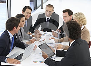 Group Of Business People Having Meeting In Office