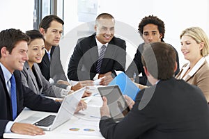 Group Of Business People Having Meeting In Office