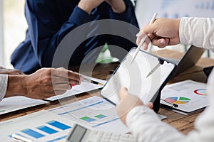 Group business people are having a meeting and planning their business together in the conference room, leaders of startup