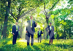 Group of Business People Holding Balloons