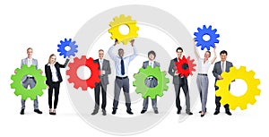 Group of Business People Holding Gear Symbol