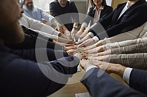 Group of business people holding hands together. Working team putting hands in circle.