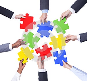 Group of Business People Holding Jigsaw