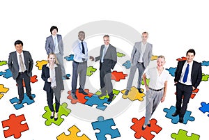 Group of Business People with Jigsaw Puzzle