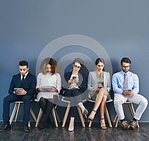 Group of business people at a job interview at a small startup company with copy space. Businesspeople sitting and