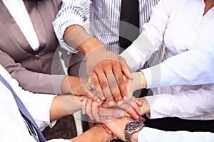 Group of Business People Join the Hand or United