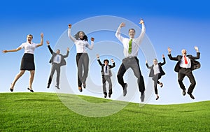 Group of Business People Jumping on the Hill